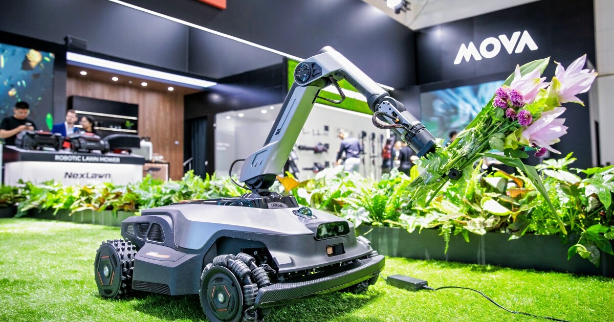 Robo-mower with arm transforms garden maintenance Robo-mower with arm transforms garden maintenance