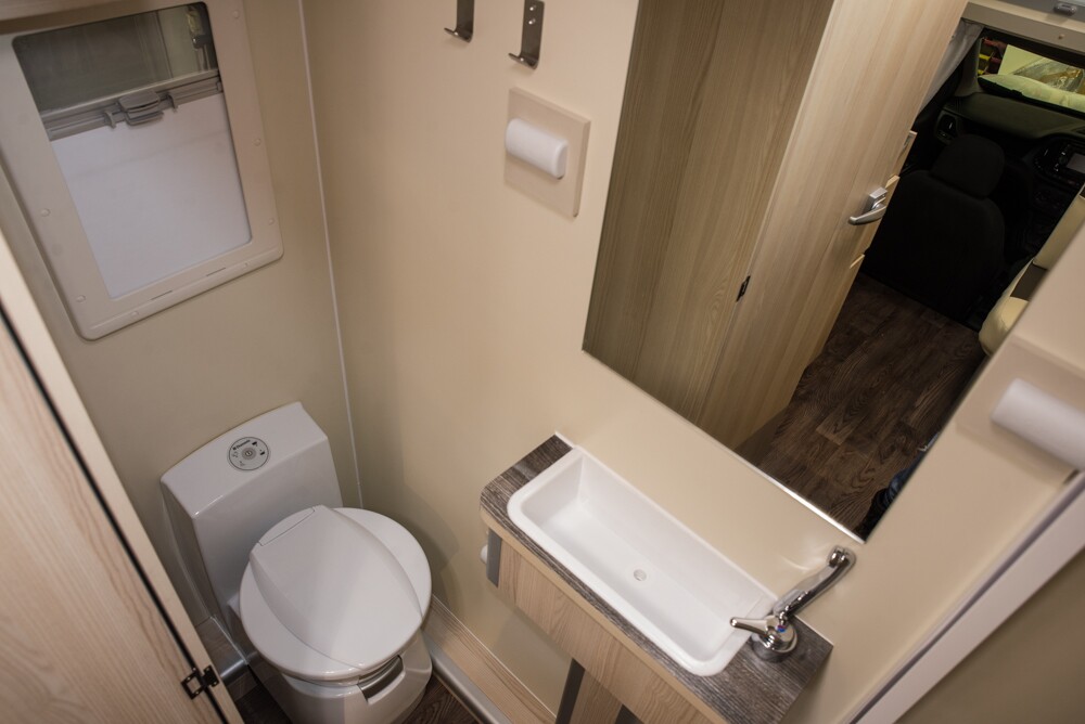 Passenger-side toilet and slim central sink on the Bela Trendy 1S