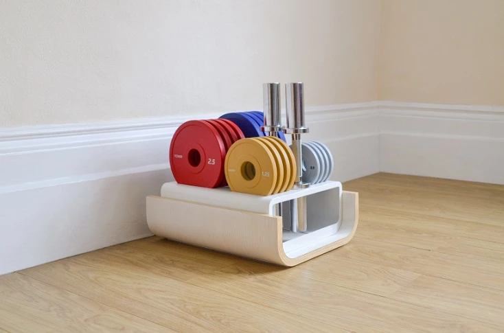 Storage racks keep weights and dumbbells organized