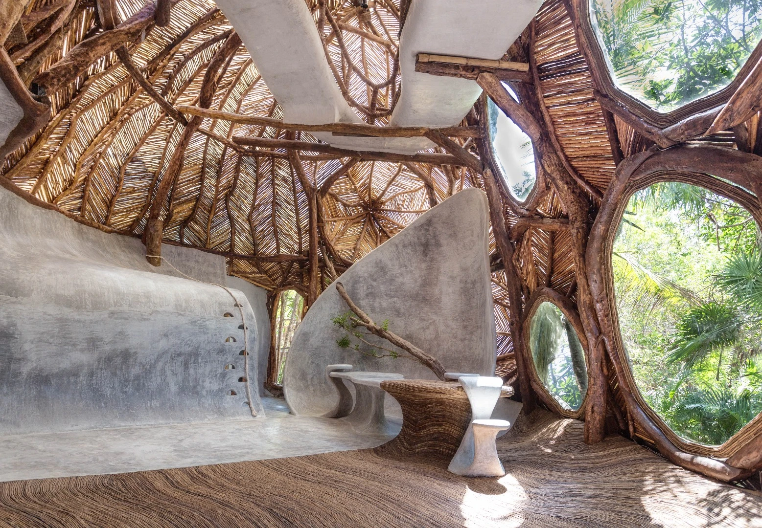 Large circular windows let loads of light into the IK Lab in Tulum, Mexico