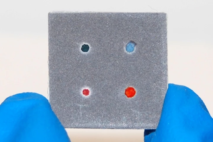 The lower right red dot indicates that this CHEMCARD paper test is ready (Photo: Scott T. Phillips)