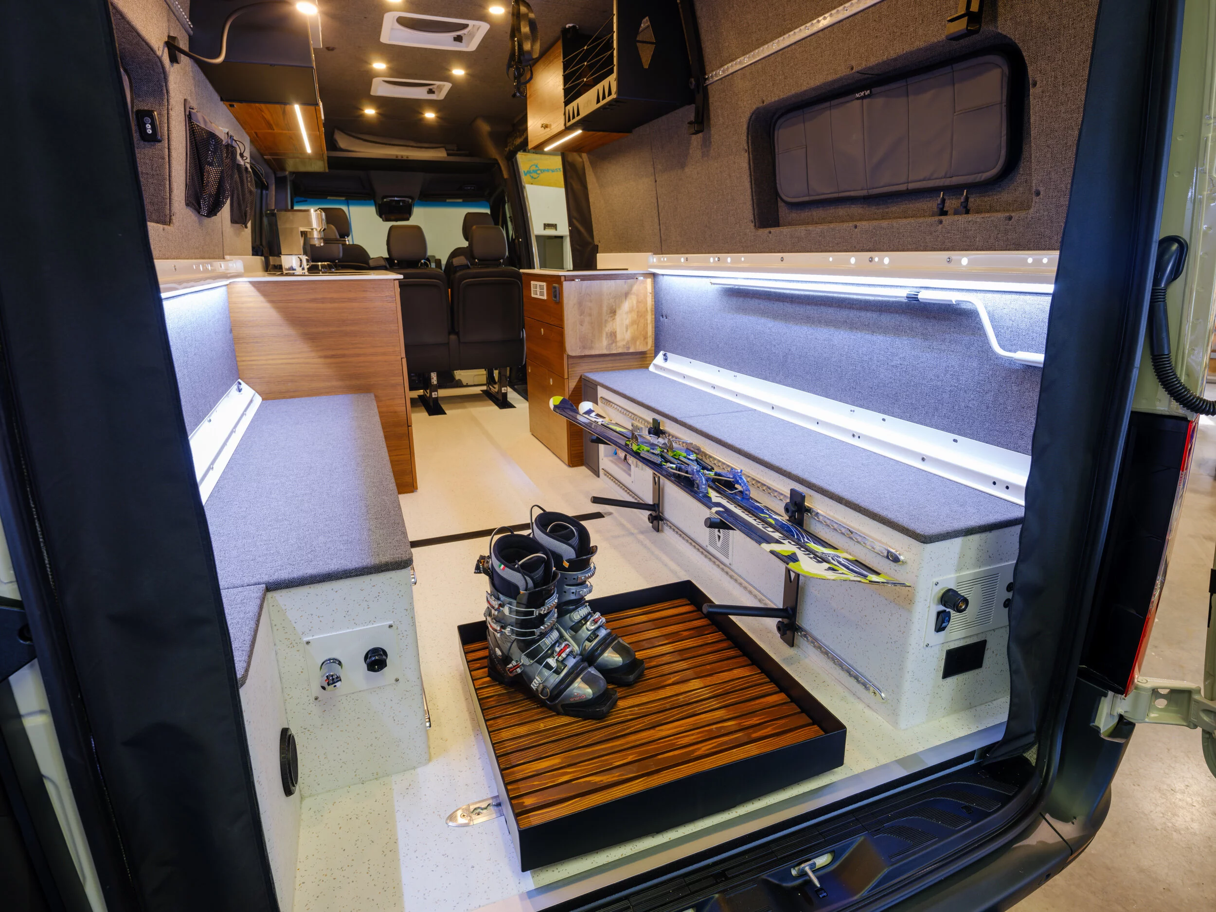 The shower pan doubles as a rack for wet boots or accessories