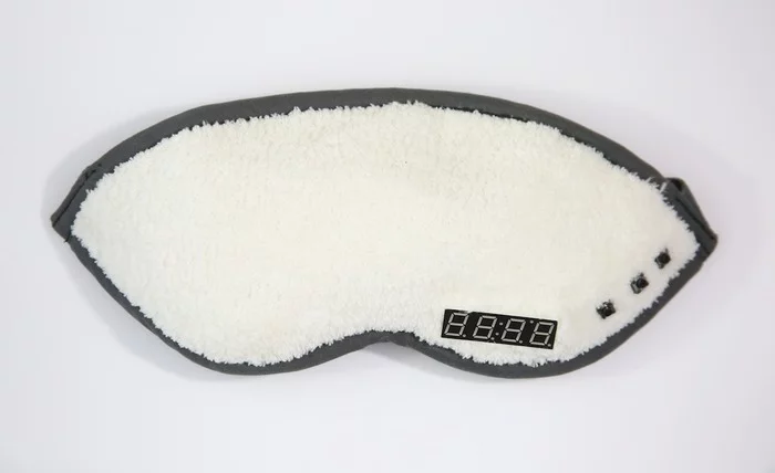 The Napwell mask as seen from the outside, with a digital timer acting as an alarm clock