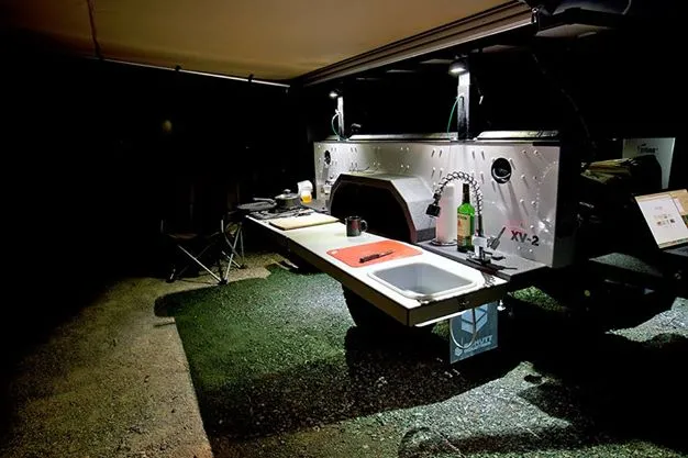 Options include a folding, full-length counter, sink and propane cooktop