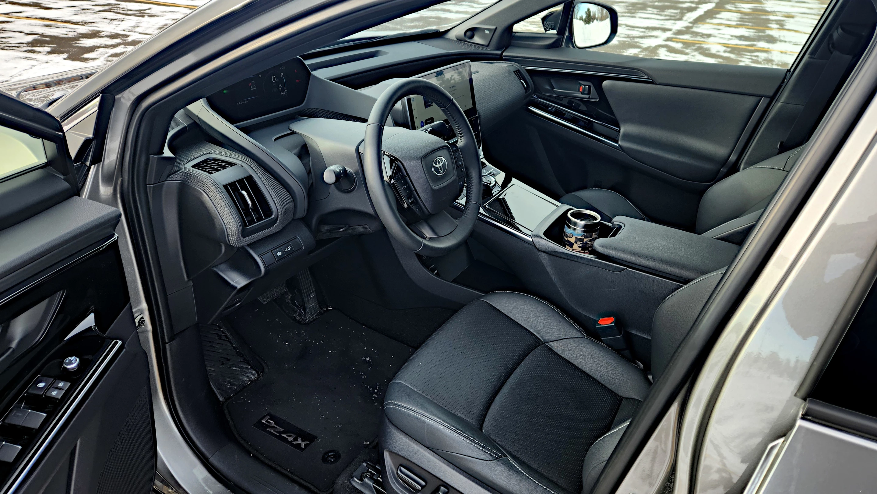 The interior of the Toyota bZ4X is very similar to the Prius models in instrumentation