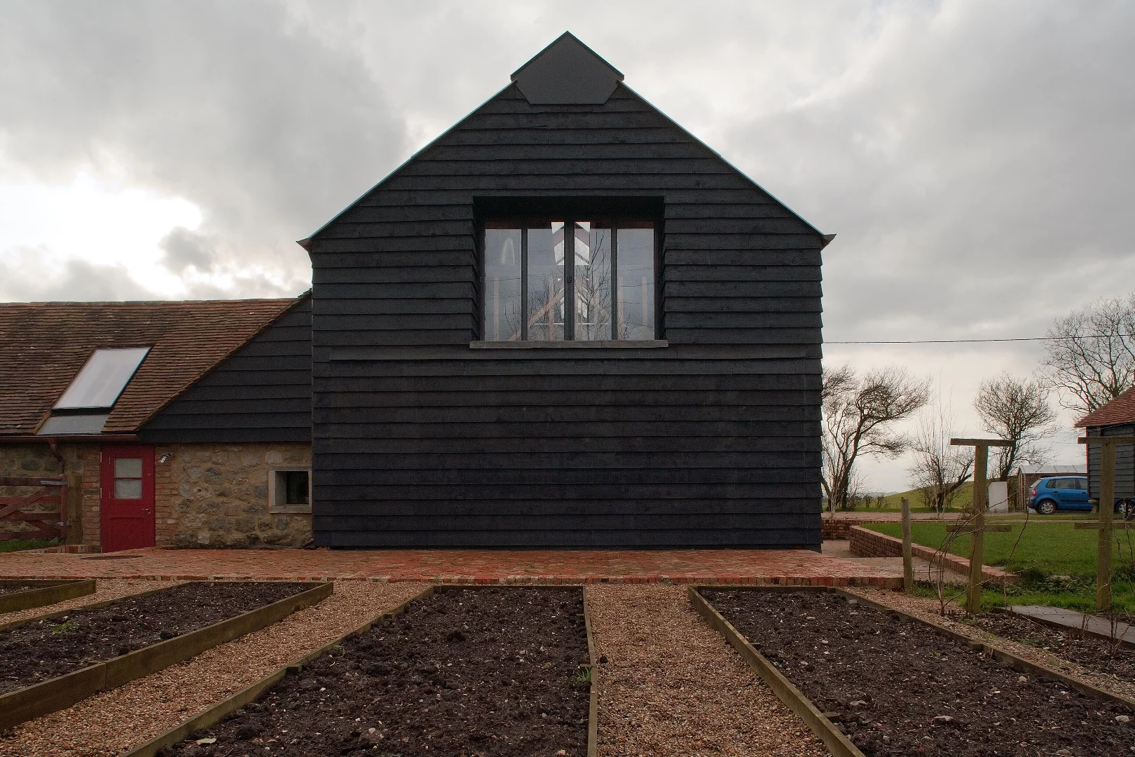 Ancient Party Barn comprises a cluster of agricultural buildings, most notably an 18th Century threshing barn