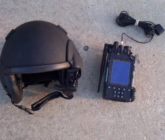 A parachutist helmet with a heads-up display is shown next to a Personal Digital Assistant (PDA) containing a Global Positioning System (GPS) and mission planning software. An eventual goal is to have a wireless connection between the display and PDA. Lon