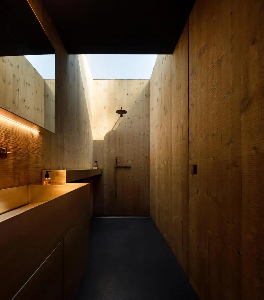 Pavilion House boasts a gorgeous timber bathroom with skylight
