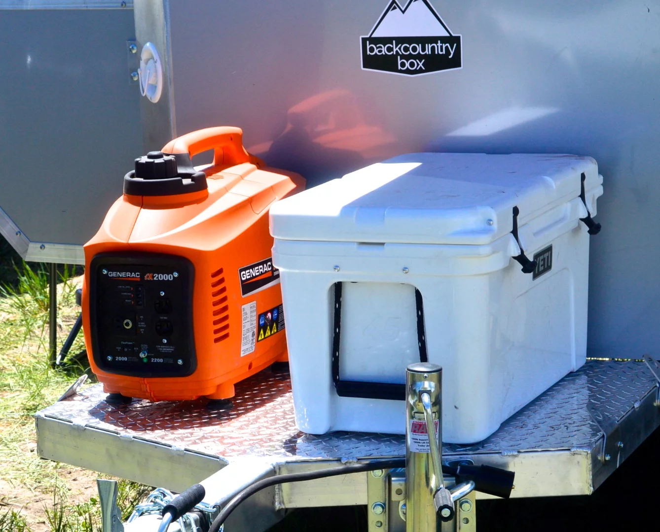 Generator and cooler up on the front of the Backcountry Box Base Camp