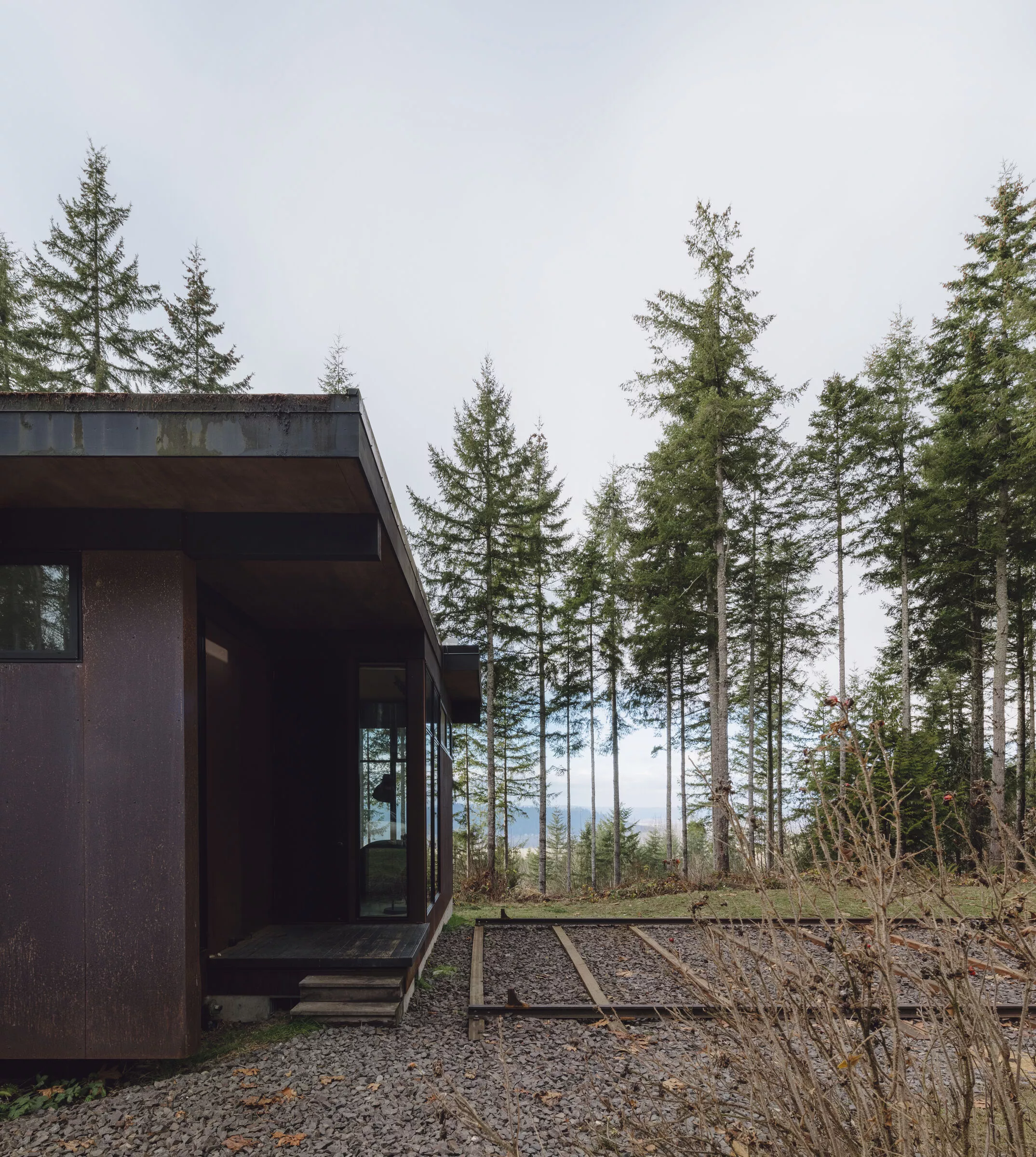 Maxon Studio is situated next to a home that was also designed by Olson Kundig Architects