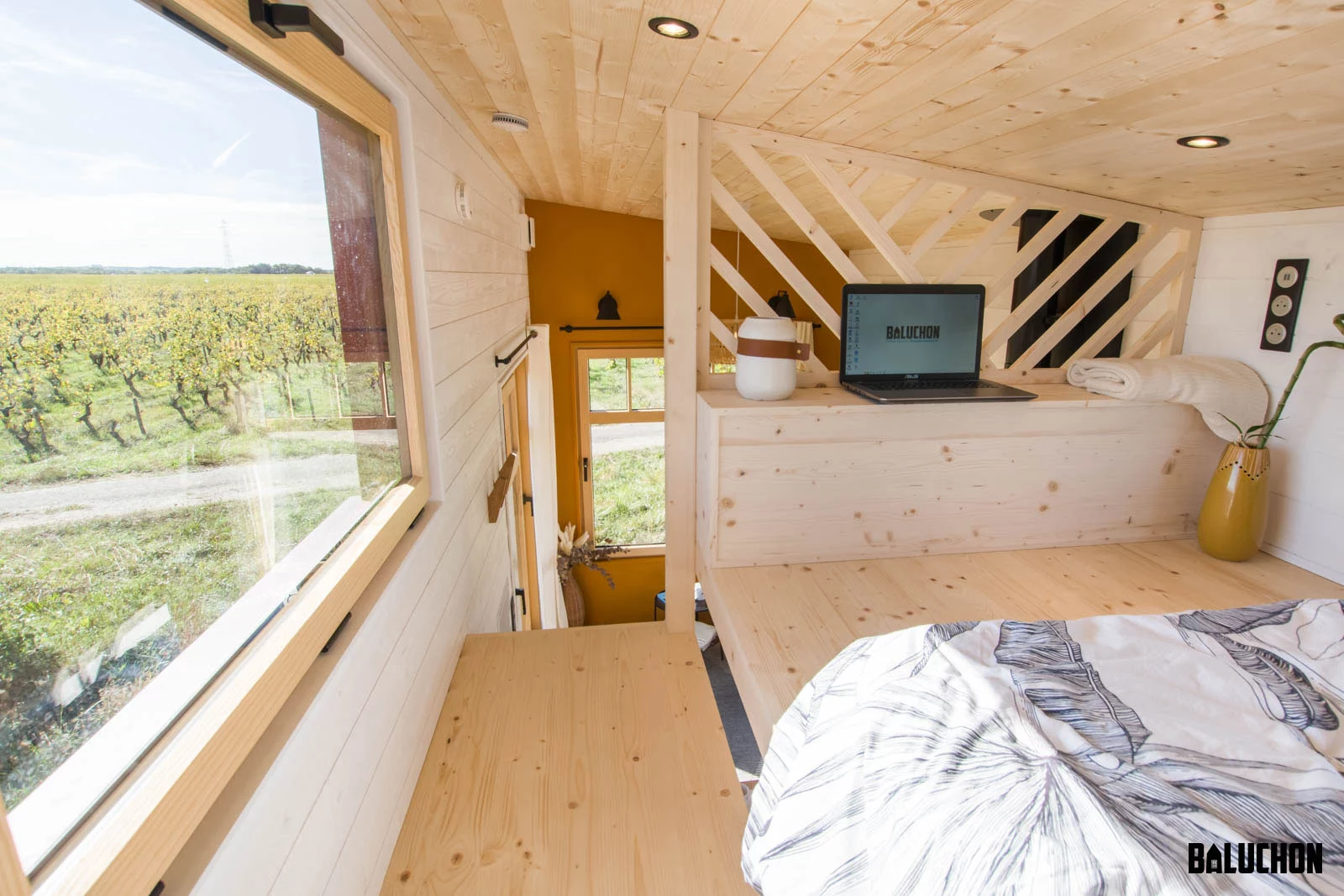The Golden Hour's bedroom includes a lowered platform, so that the owner can get dressed standing upright