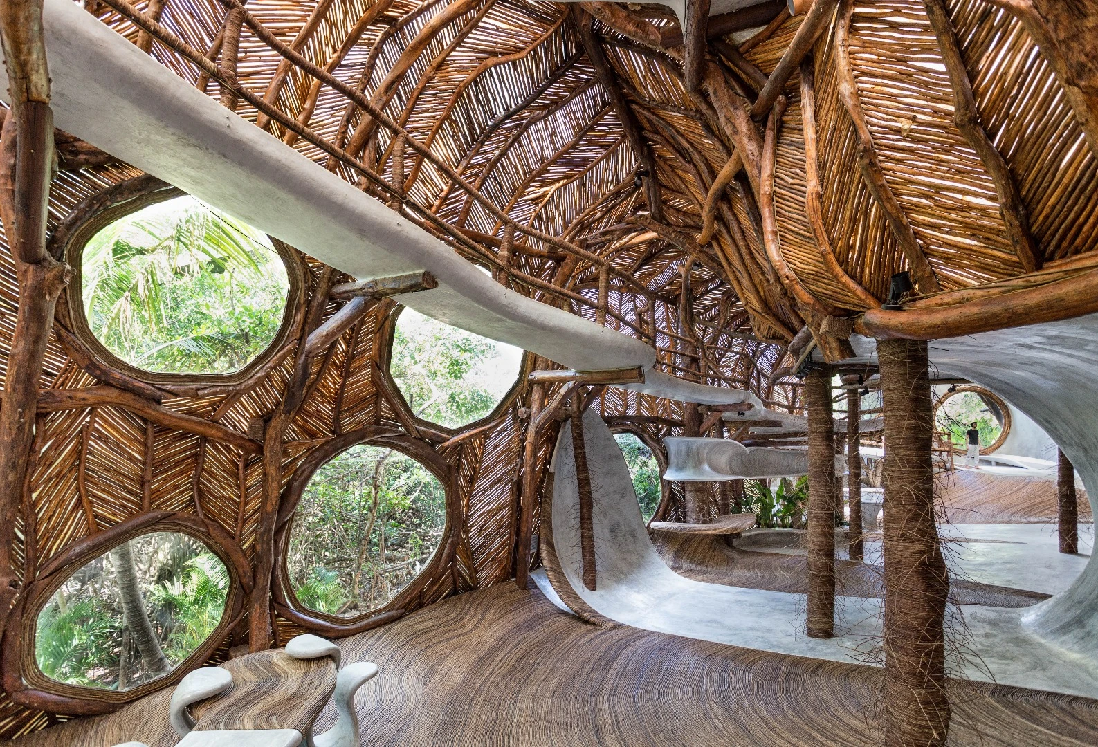 Large circular windows let loads of light into the IK Lab in Tulum, Mexico