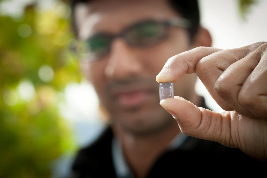 Doctoral student Vinay Pagay holds one of the chips