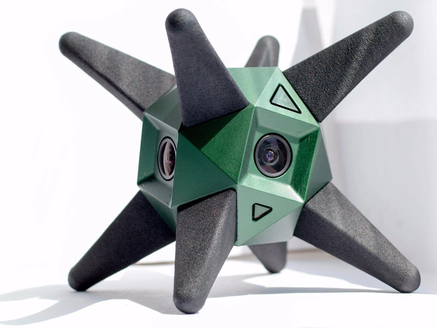 While (very) loosely spherical in shape, the camera features angled faces so that it can be either fixed to tripod mounts or plonked down by itself on flat surfaces
